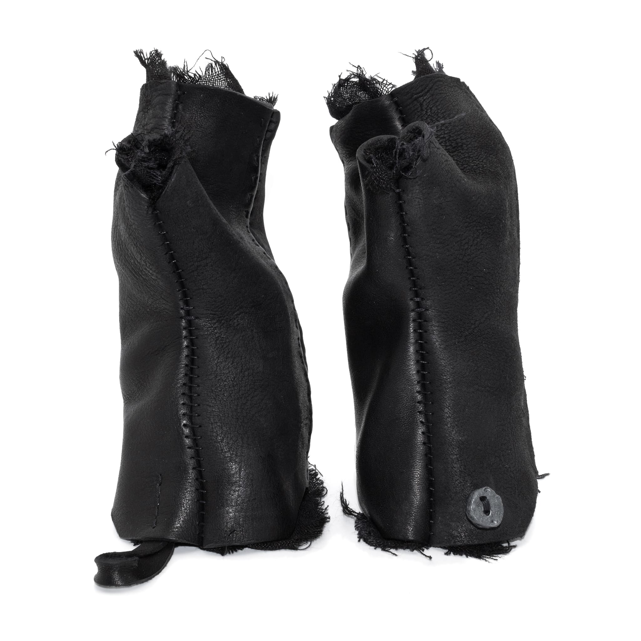 hand stitched over a 35hr period the washed cordovan gloves feature deconstructed open seam panels, hand forged solid .999 sterling silver button and a raw cut stone washed ramie lining. the gloves are available to buy online from avant garde leather studio atelierskn.com