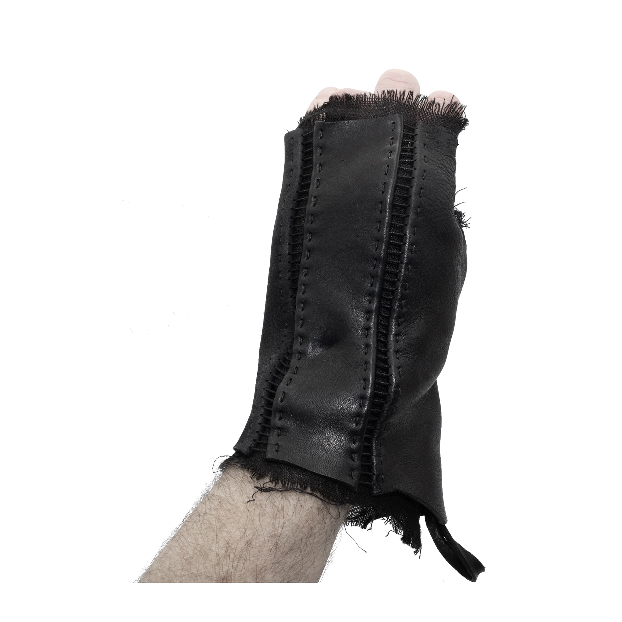 hand stitched over a 35hr period the washed cordovan gloves feature deconstructed open seam panels, hand forged solid .999 sterling silver button and a raw cut stone washed ramie lining. the gloves are available to buy online from avant garde leather studio atelierskn.com