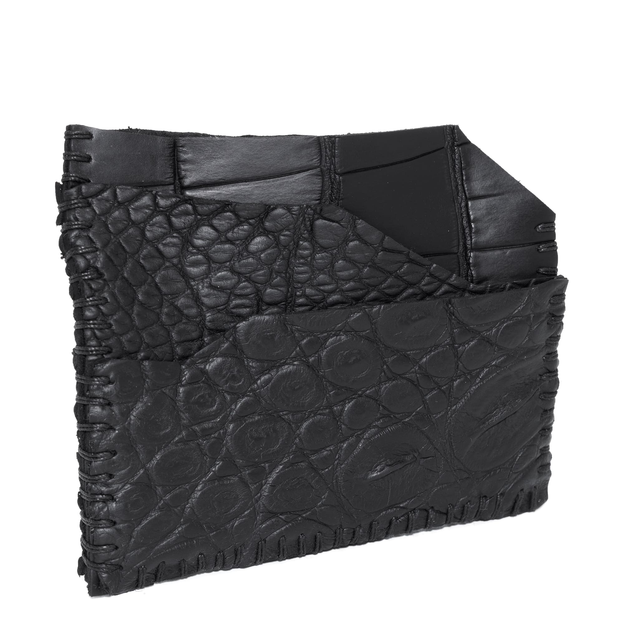 hand stitched over an 8 hour period the genuine crocodile cardholder features multiple card slots, hand stitched overlock sides and an array of unique textures. the cardholder is available to buy online from avant garde leather studio atelierskn.com