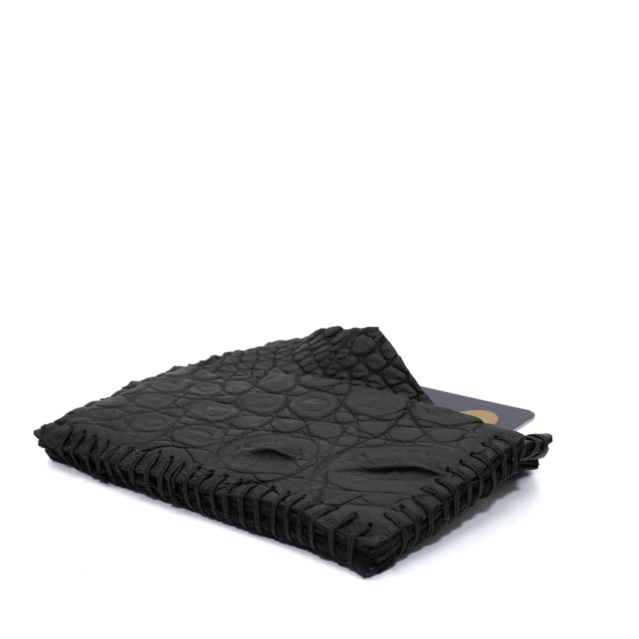 hand stitched over an 8 hour period the genuine crocodile cardholder features multiple card slots, hand stitched overlock sides and an array of unique textures. the cardholder is available to buy online from avant garde leather studio atelierskn.com