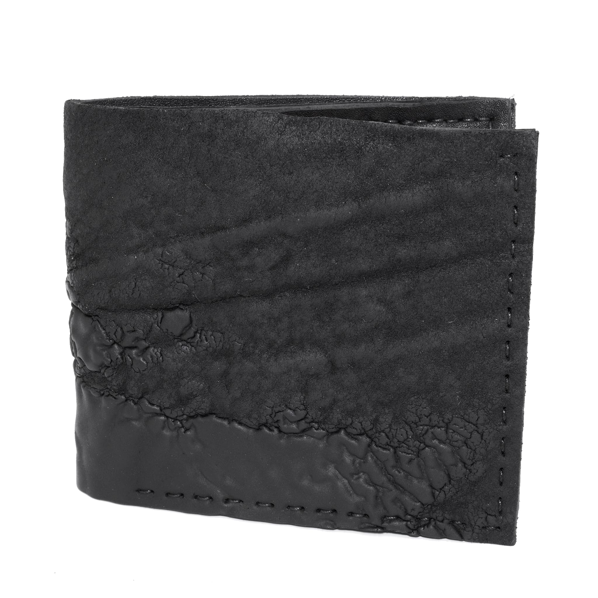 a closed seam 8 pocket bifold wallet crafted from a butter soft reverse culatta leather with a matte black object dyed finish. a riri zipper pocket is adorned with a hand forged solid .925sterling silver zipper pull available to buy online from artisanal leather studio atelierskn.com