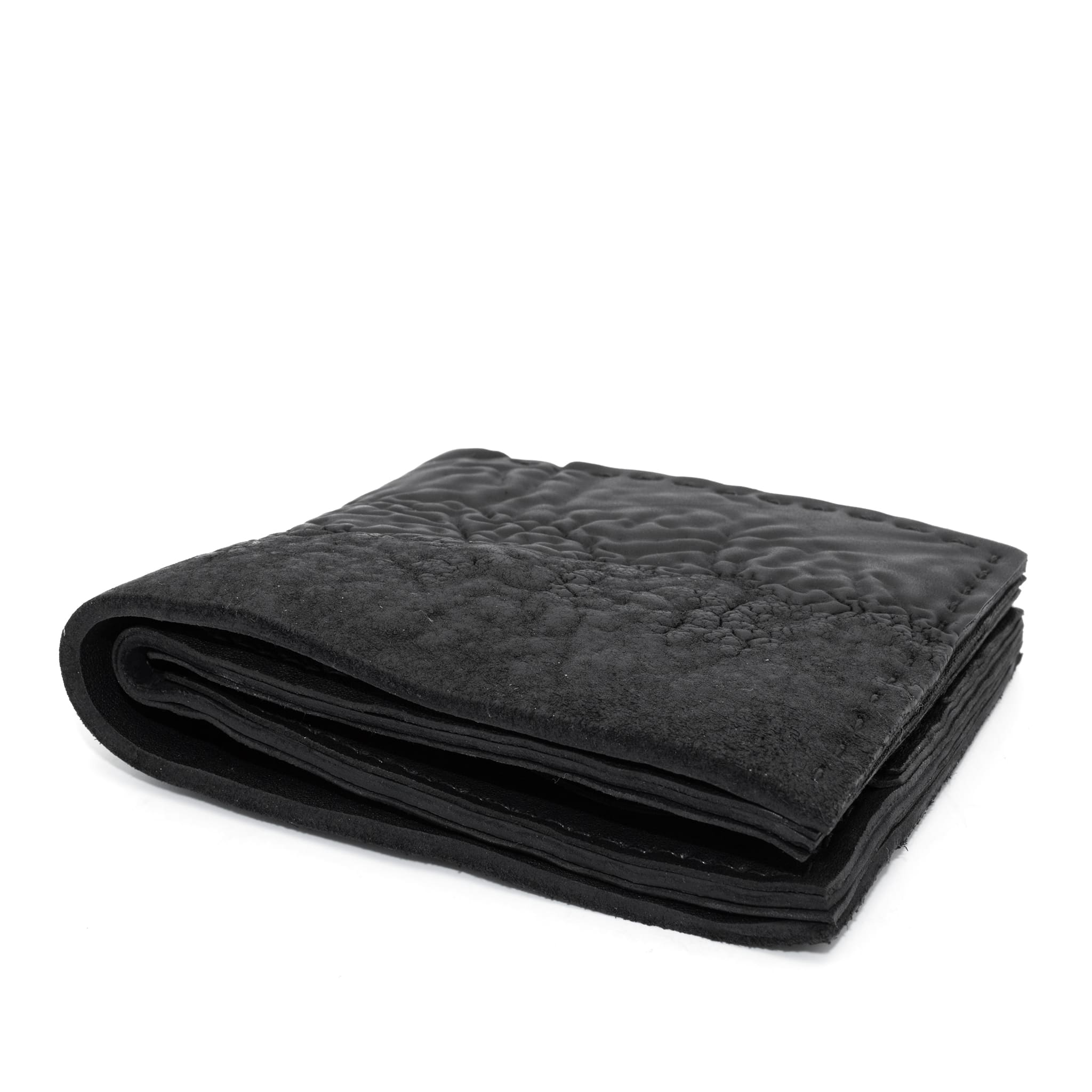 a closed seam 8 pocket bifold wallet crafted from a butter soft reverse culatta leather with a matte black object dyed finish. a riri zipper pocket is adorned with a hand forged solid .925sterling silver zipper pull available to buy online from artisanal leather studio atelierskn.com
