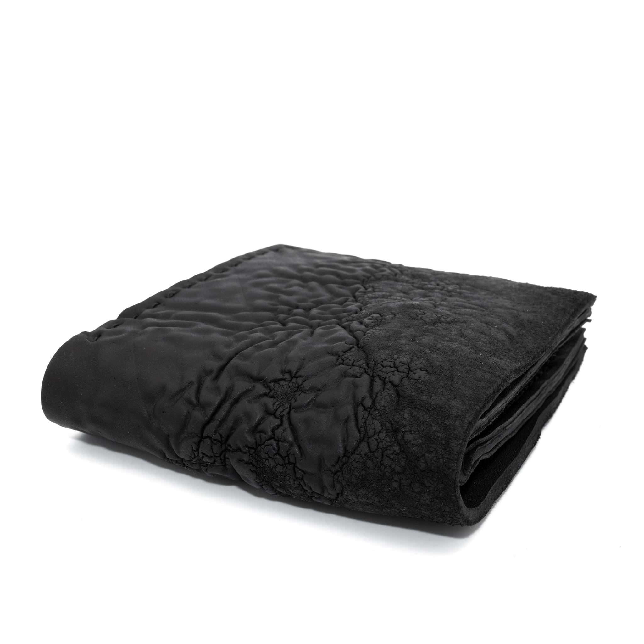 a closed seam 8 pocket bifold wallet crafted from a butter soft reverse culatta leather with a matte black object dyed finish. a riri zipper pocket is adorned with a hand forged solid .925sterling silver zipper pull available to buy online from artisanal leather studio atelierskn.com