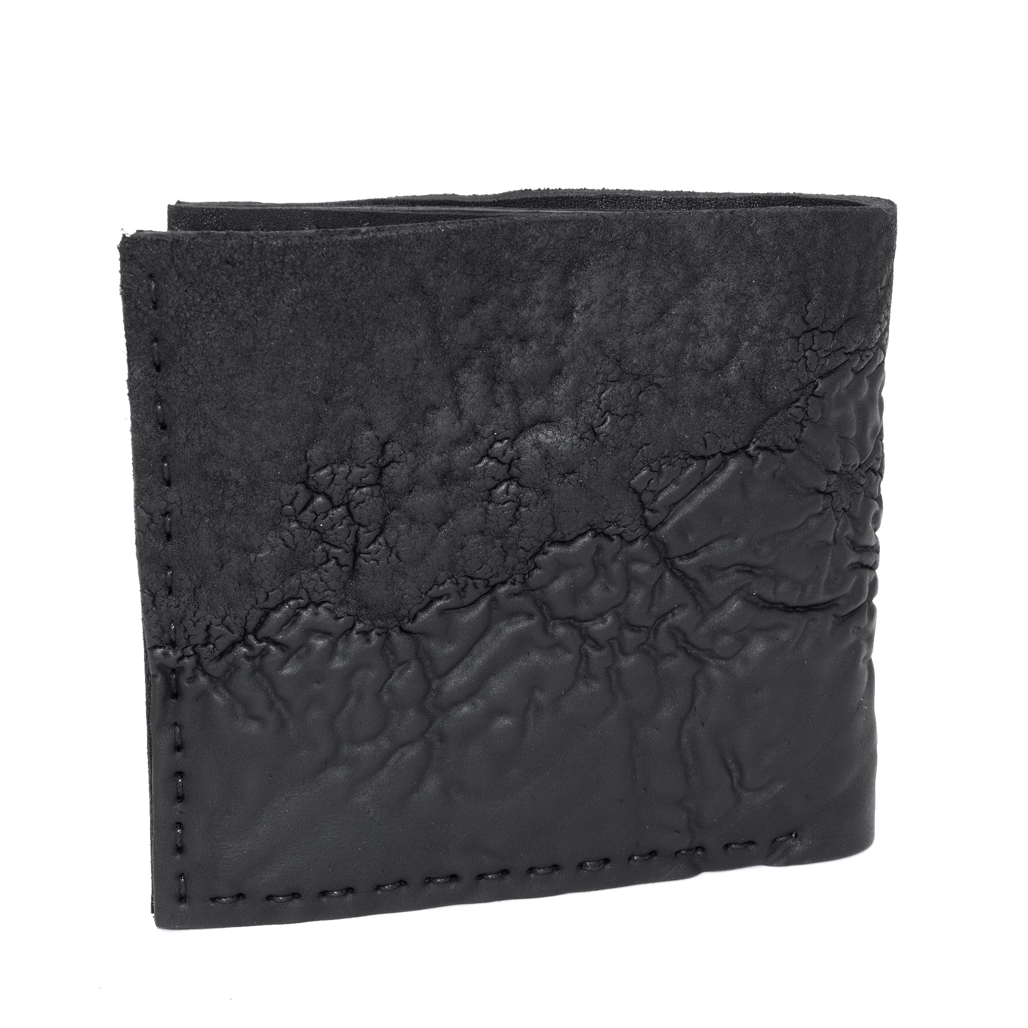 a closed seam 8 pocket bifold wallet crafted from a butter soft reverse culatta leather with a matte black object dyed finish. a riri zipper pocket is adorned with a hand forged solid .925sterling silver zipper pull available to buy online from artisanal leather studio atelierskn.com