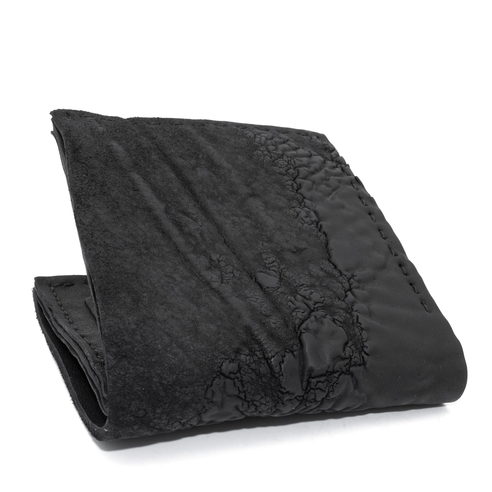 a closed seam 8 pocket bifold wallet crafted from a butter soft reverse culatta leather with a matte black object dyed finish. a riri zipper pocket is adorned with a hand forged solid .925sterling silver zipper pull available to buy online from artisanal leather studio atelierskn.com