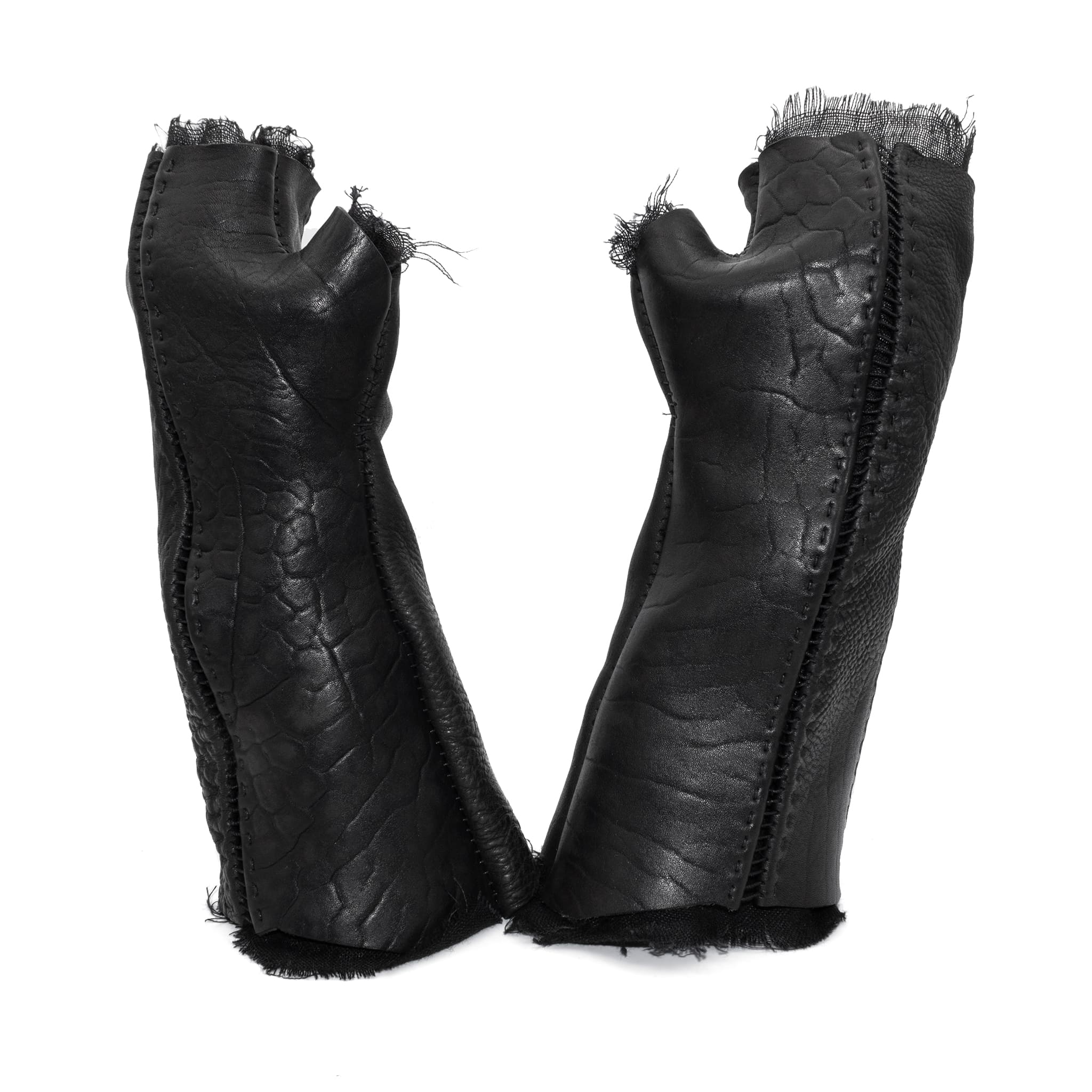 hand stitched over a 40hr period the washed culatta leather gloves feature deconstructed open seam panels, and a stone washed ramie lining. wet moulded on the body over an 8 hour period for a sculptured aesthetic. the gloves are available to buy online from avant garde leather studio atelierskn.com