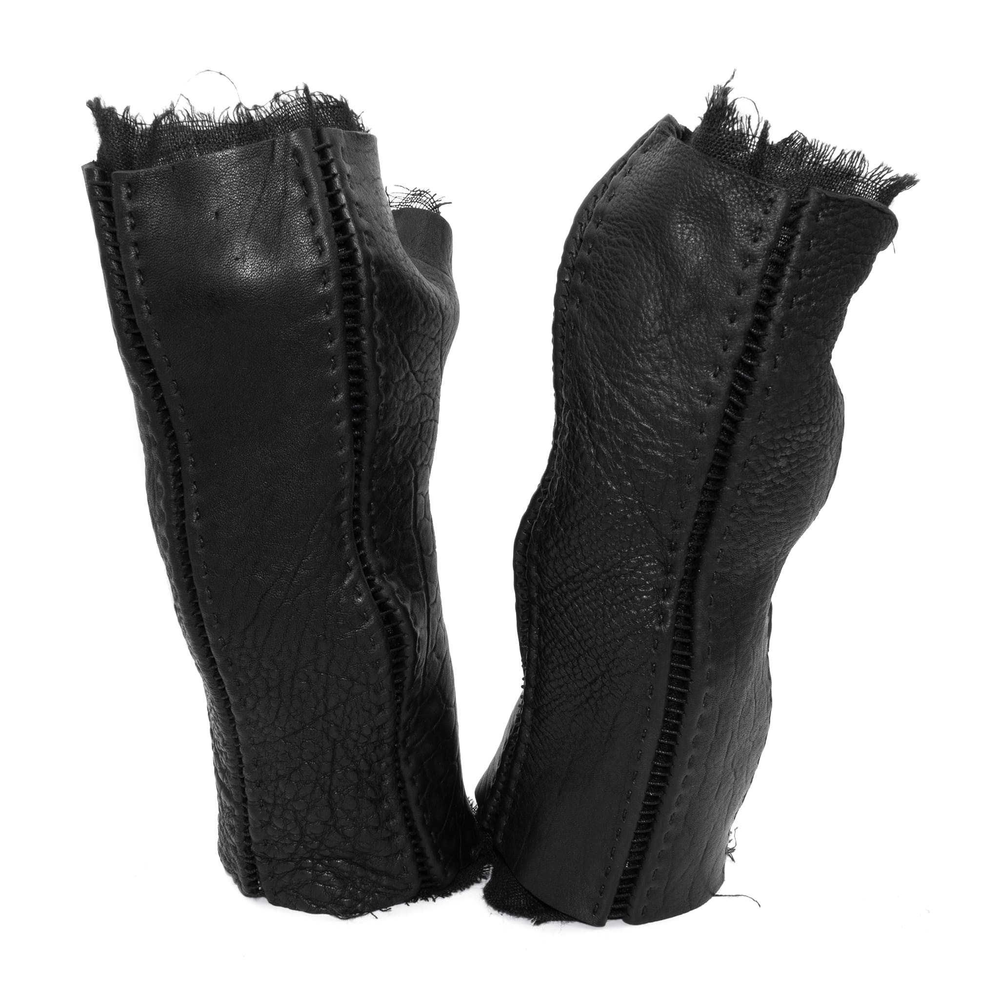 hand stitched over a 40hr period the washed culatta leather gloves feature deconstructed open seam panels, and a stone washed ramie lining. wet moulded on the body over an 8 hour period for a sculptured aesthetic. the gloves are available to buy online from avant garde leather studio atelierskn.com