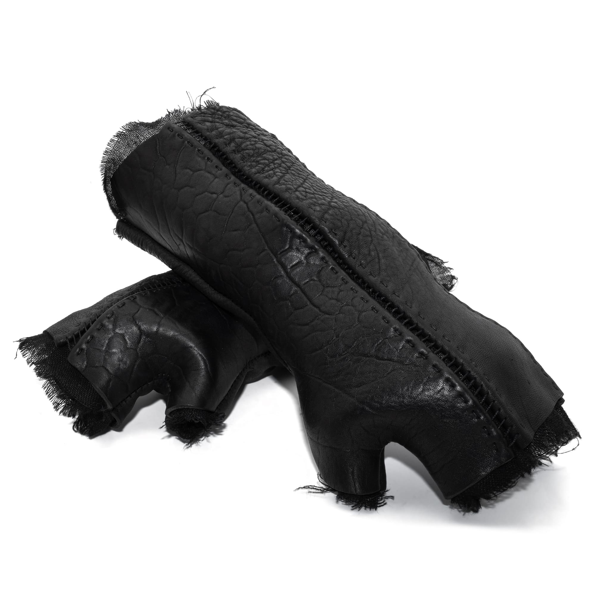hand stitched over a 40hr period the washed culatta leather gloves feature deconstructed open seam panels, and a stone washed ramie lining. wet moulded on the body over an 8 hour period for a sculptured aesthetic. the gloves are available to buy online from avant garde leather studio atelierskn.com