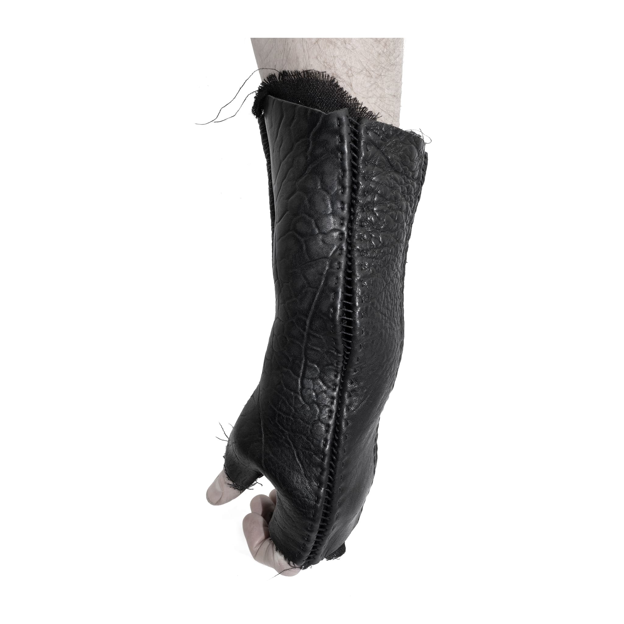 hand stitched over a 40hr period the washed culatta leather gloves feature deconstructed open seam panels, and a stone washed ramie lining. wet moulded on the body over an 8 hour period for a sculptured aesthetic. the gloves are available to buy online from avant garde leather studio atelierskn.com