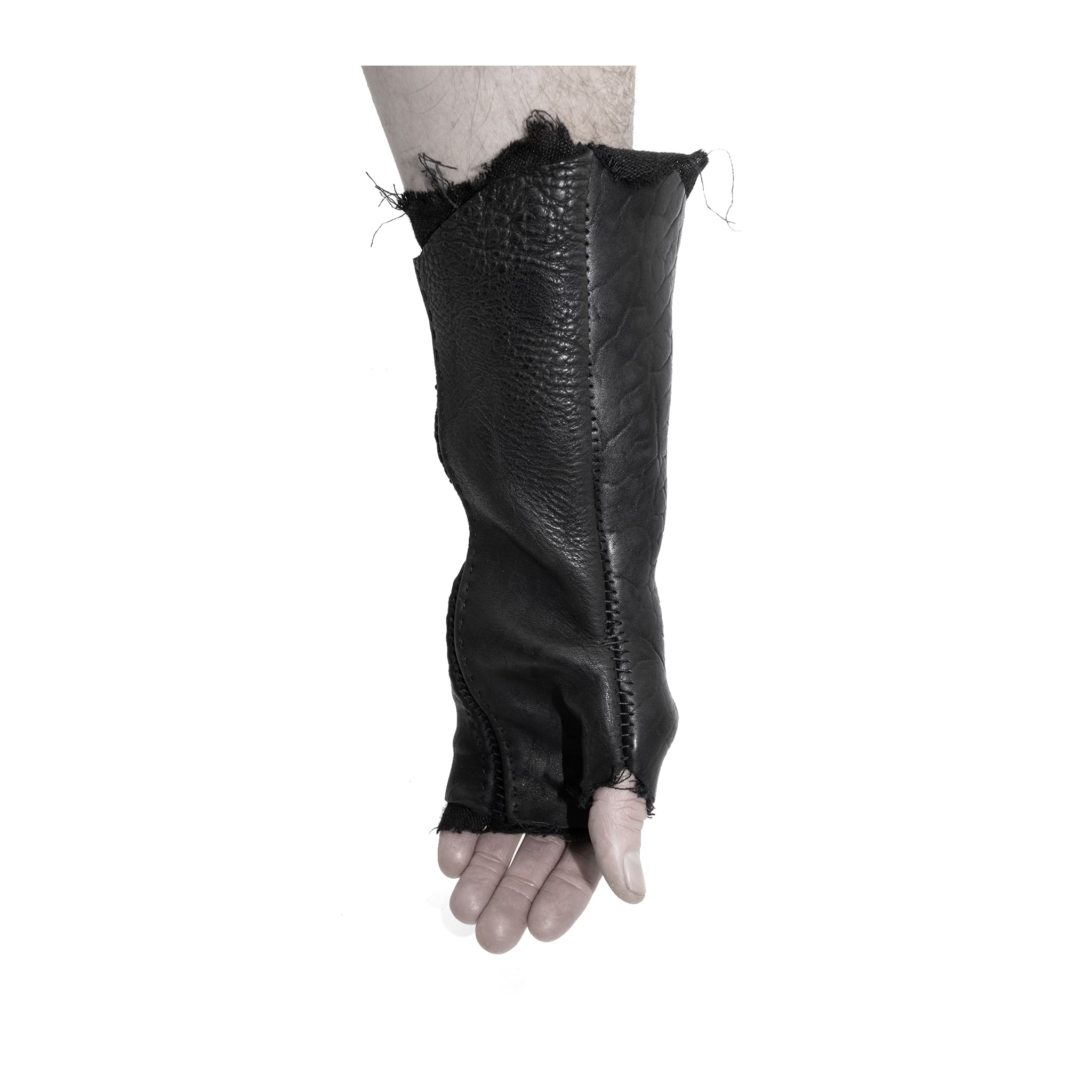 hand stitched over a 40hr period the washed culatta leather gloves feature deconstructed open seam panels, and a stone washed ramie lining. wet moulded on the body over an 8 hour period for a sculptured aesthetic. the gloves are available to buy online from avant garde leather studio atelierskn.com