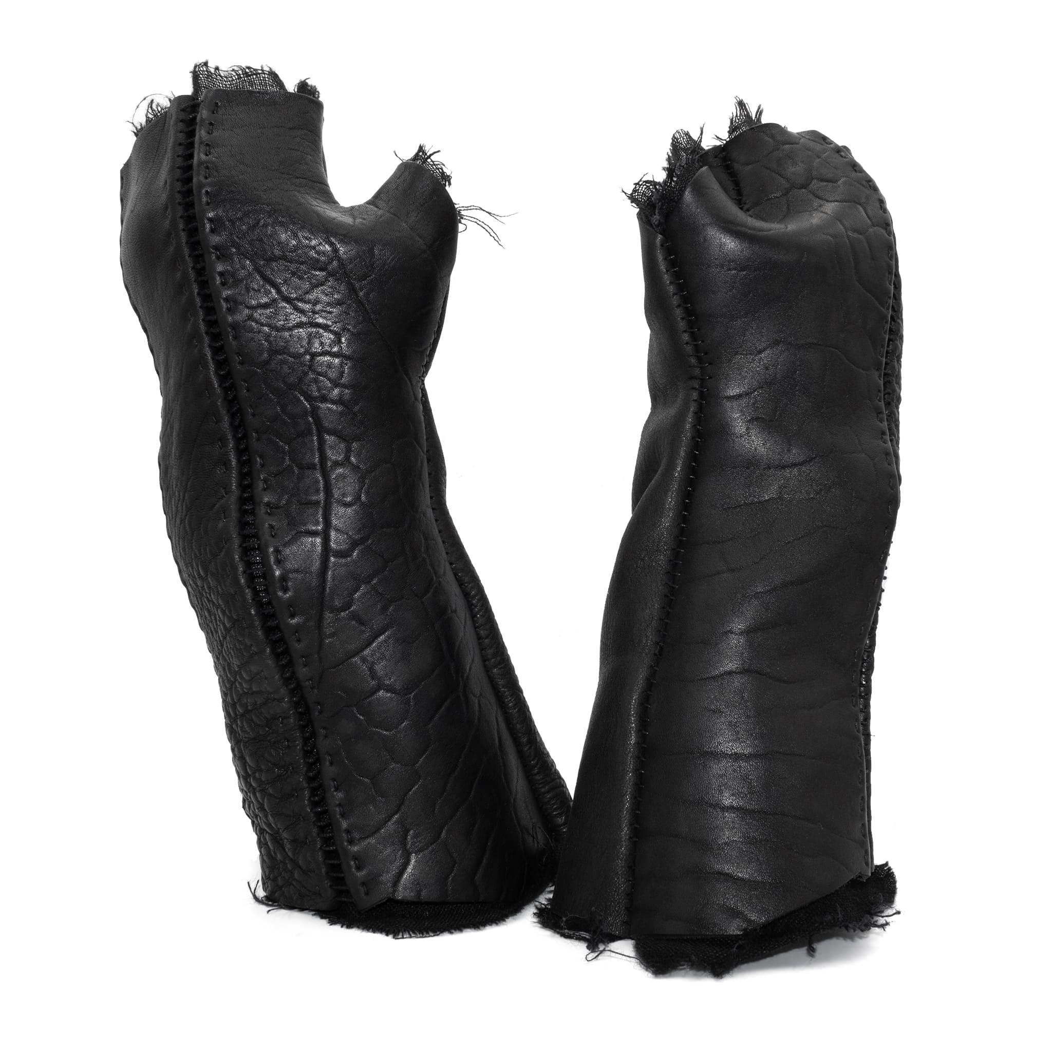 hand stitched over a 40hr period the washed culatta leather gloves feature deconstructed open seam panels, and a stone washed ramie lining. wet moulded on the body over an 8 hour period for a sculptured aesthetic. the gloves are available to buy online from avant garde leather studio atelierskn.com