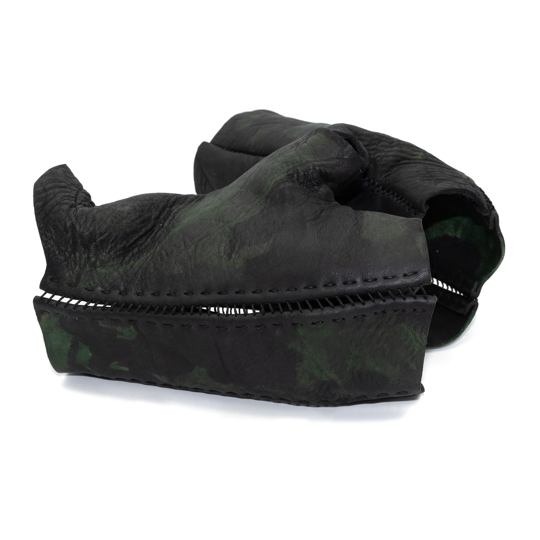 hand stitched over a 35hr period the washed horse culatta leather gloves feature deconstructed open seam panels, and a multiple layer absinthe dye treatment. the gloves are available to buy online from avant garde leather studio atelierskn.com