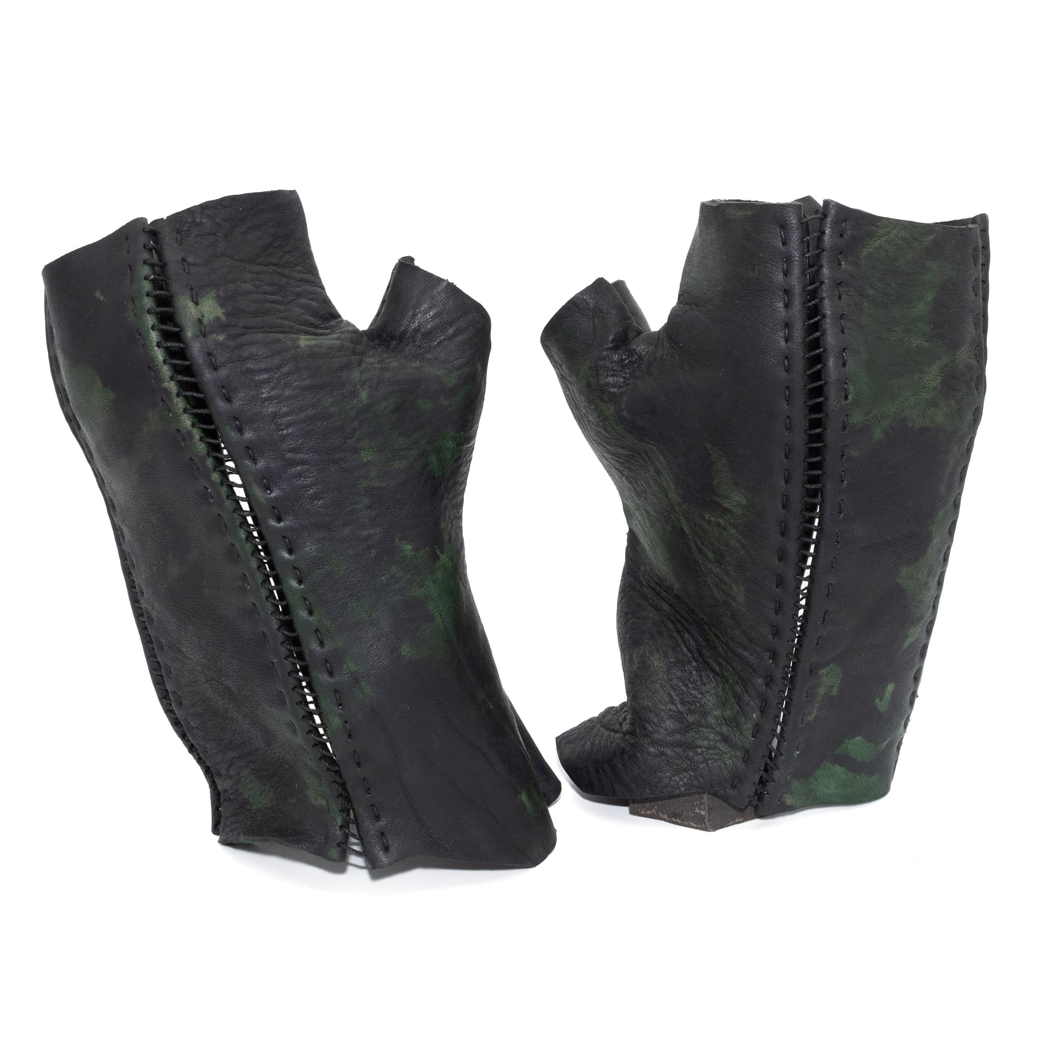 hand stitched over a 35hr period the washed horse culatta leather gloves feature deconstructed open seam panels, and a multiple layer absinthe dye treatment. the gloves are available to buy online from avant garde leather studio atelierskn.com