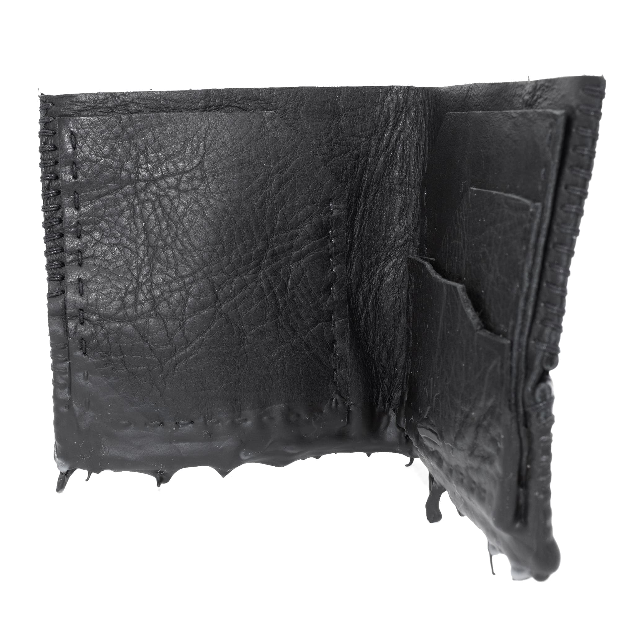 a closed seam 4 pocket bifold wallet crafted from a supple matte black washed horse leather with a closed seam construction. the wallet features a tonal rubber drip and is available to buy online from artisanal leather studio atelierskn.com