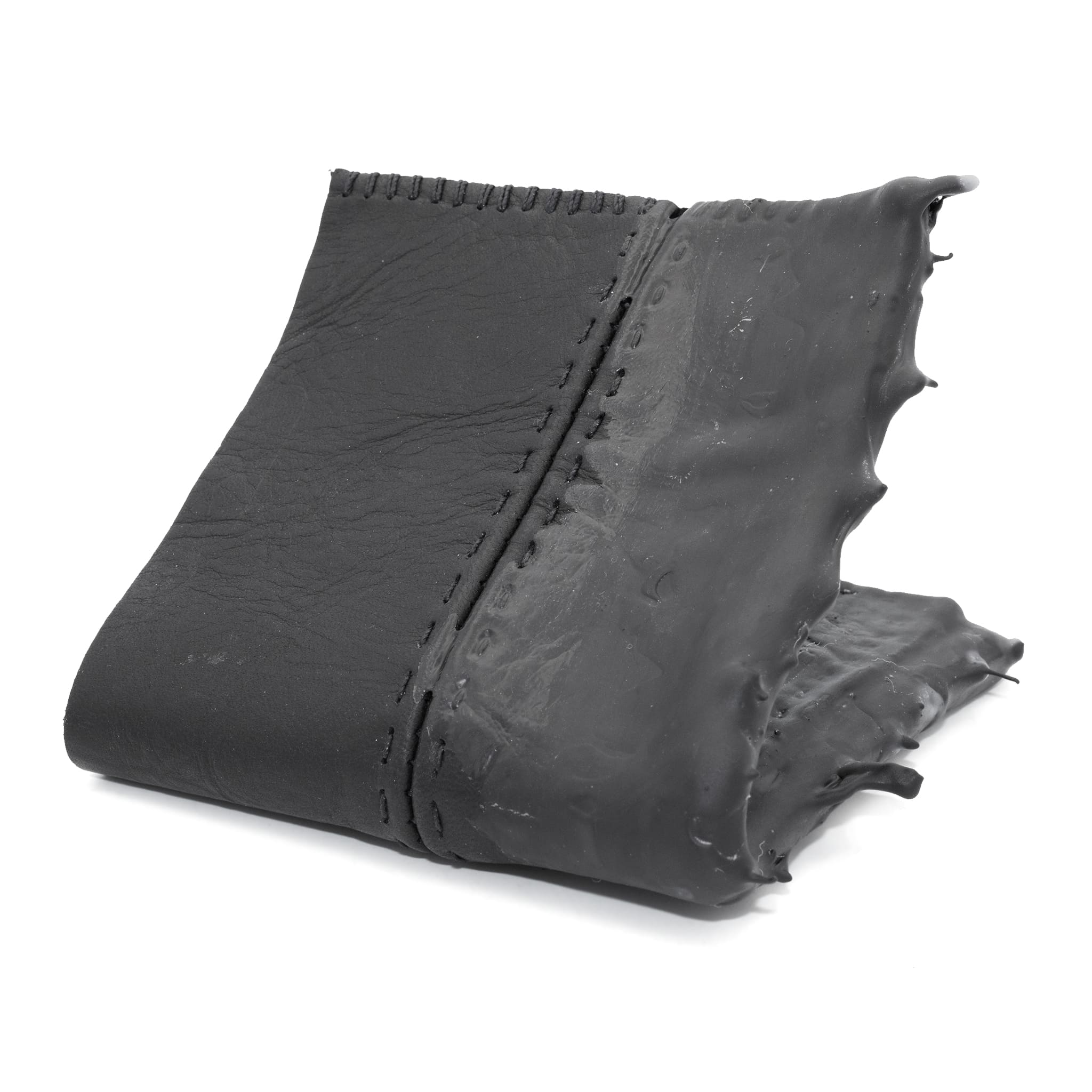a closed seam 4 pocket bifold wallet crafted from a supple matte black washed horse leather with a closed seam construction. the wallet features a tonal rubber drip and is available to buy online from artisanal leather studio atelierskn.com