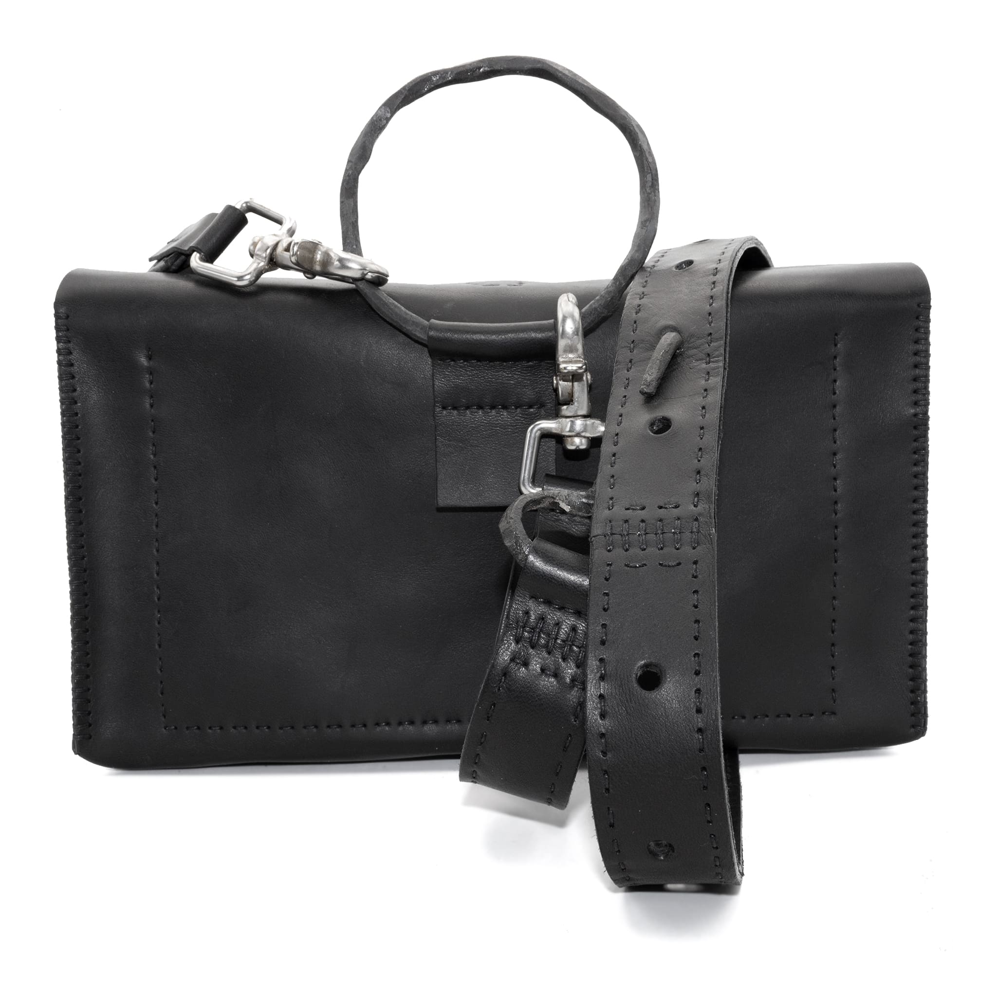 meticulously hand sewn, the washed horse leather landscape shoulder bag is crafted from a single piece pattern and features a minimal silhouette, an object dye treatment, tonal linen stitching and hand forged iron hardware. a large iron ring acts as a handle and an anchor for the detachable strap. the cross body bag is available to buy online from avant garde designer atelierskn.com