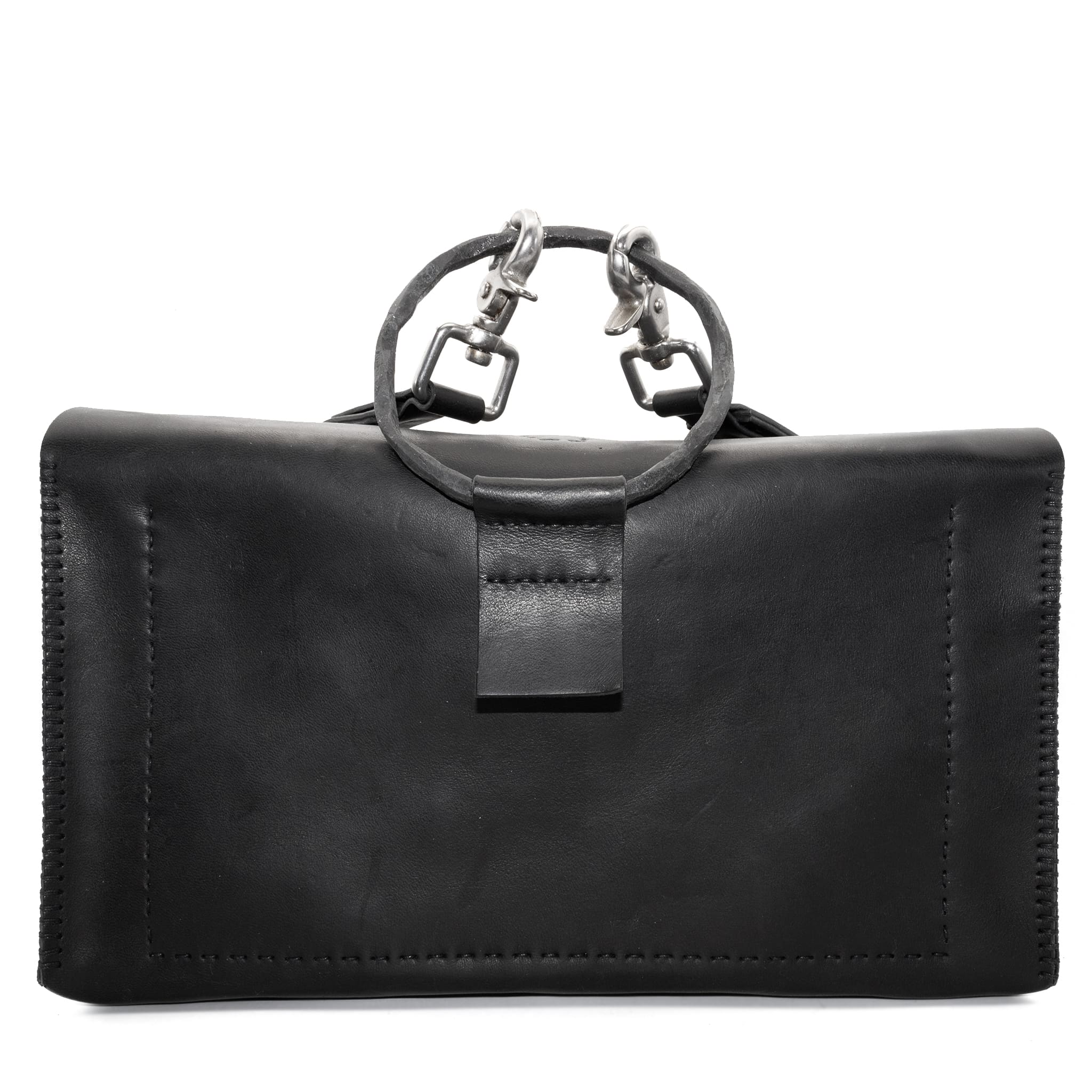meticulously hand sewn, the washed horse leather landscape shoulder bag is crafted from a single piece pattern and features a minimal silhouette, an object dye treatment, tonal linen stitching and hand forged iron hardware. a large iron ring acts as a handle and an anchor for the detachable strap. the cross body bag is available to buy online from avant garde designer atelierskn.com
