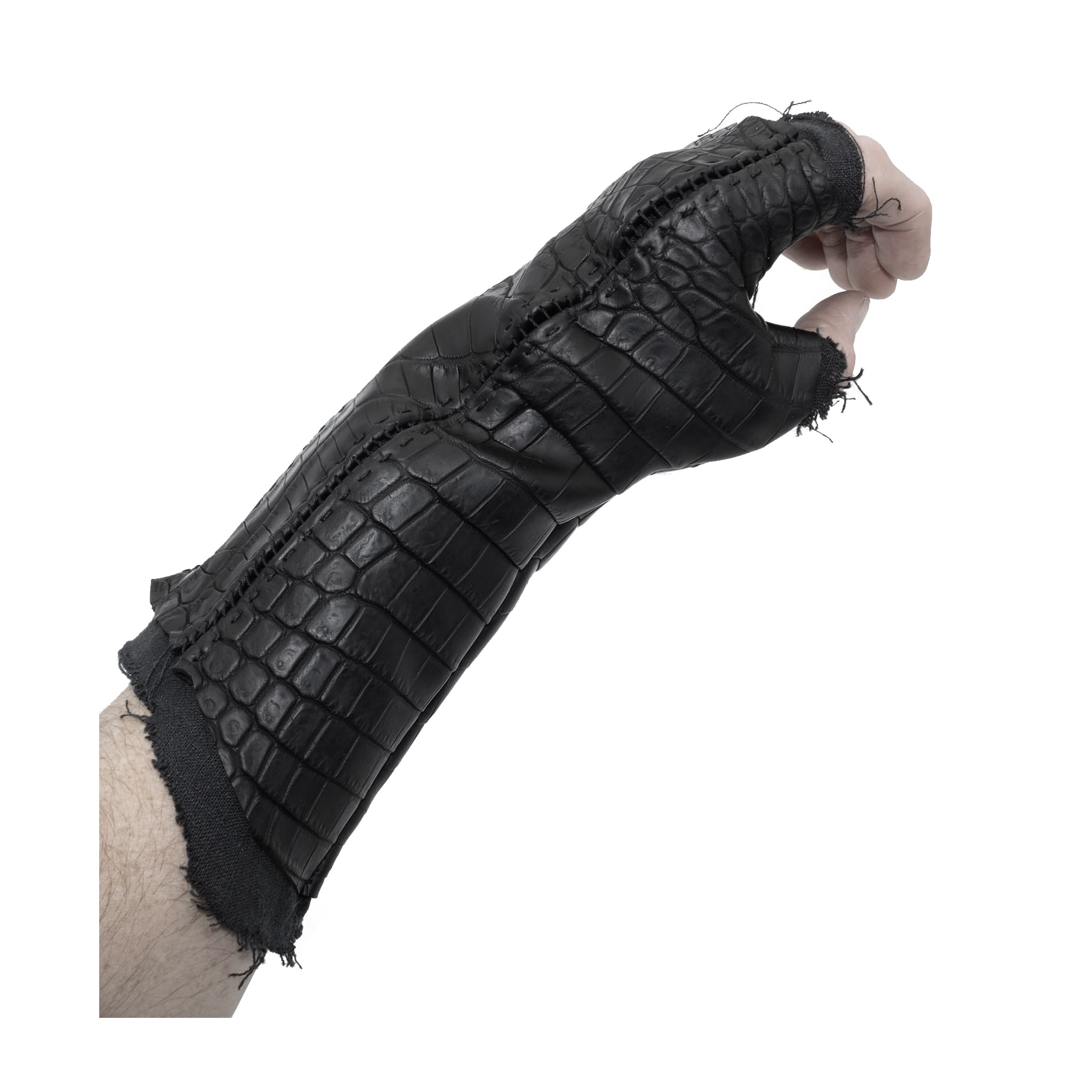 hand stitched over a 40hr period the genuine crocodile leather gloves feature deconstructed open seam panels, and a raw cut stone washed ramie lining. with an object dyed finish the gloves are then wet moulded on the body over an 8 hour period for a sculptured aesthetic. the gloves are available to buy online from avant garde leather studio atelierskn.com