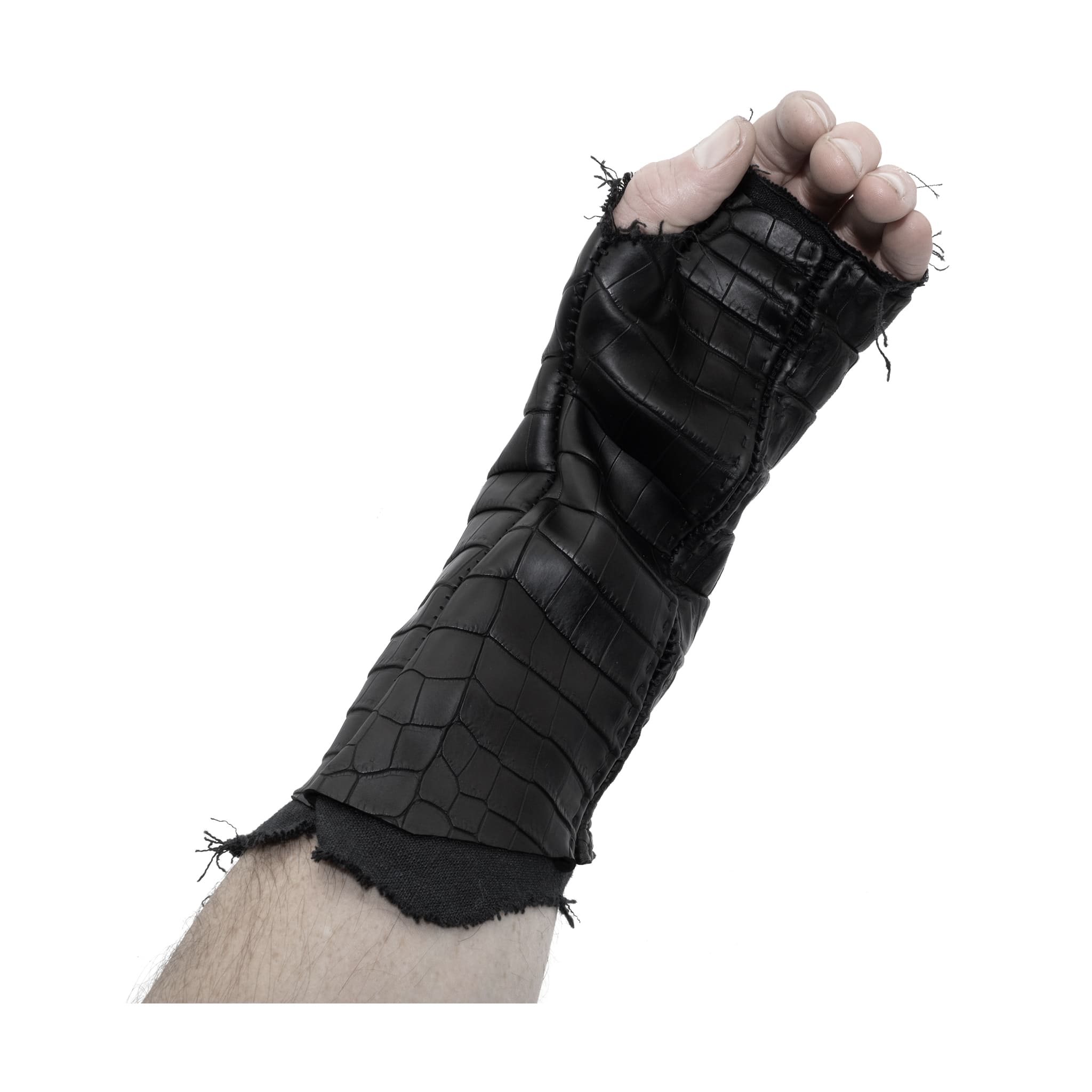 hand stitched over a 40hr period the genuine crocodile leather gloves feature deconstructed open seam panels, and a raw cut stone washed ramie lining. with an object dyed finish the gloves are then wet moulded on the body over an 8 hour period for a sculptured aesthetic. the gloves are available to buy online from avant garde leather studio atelierskn.com