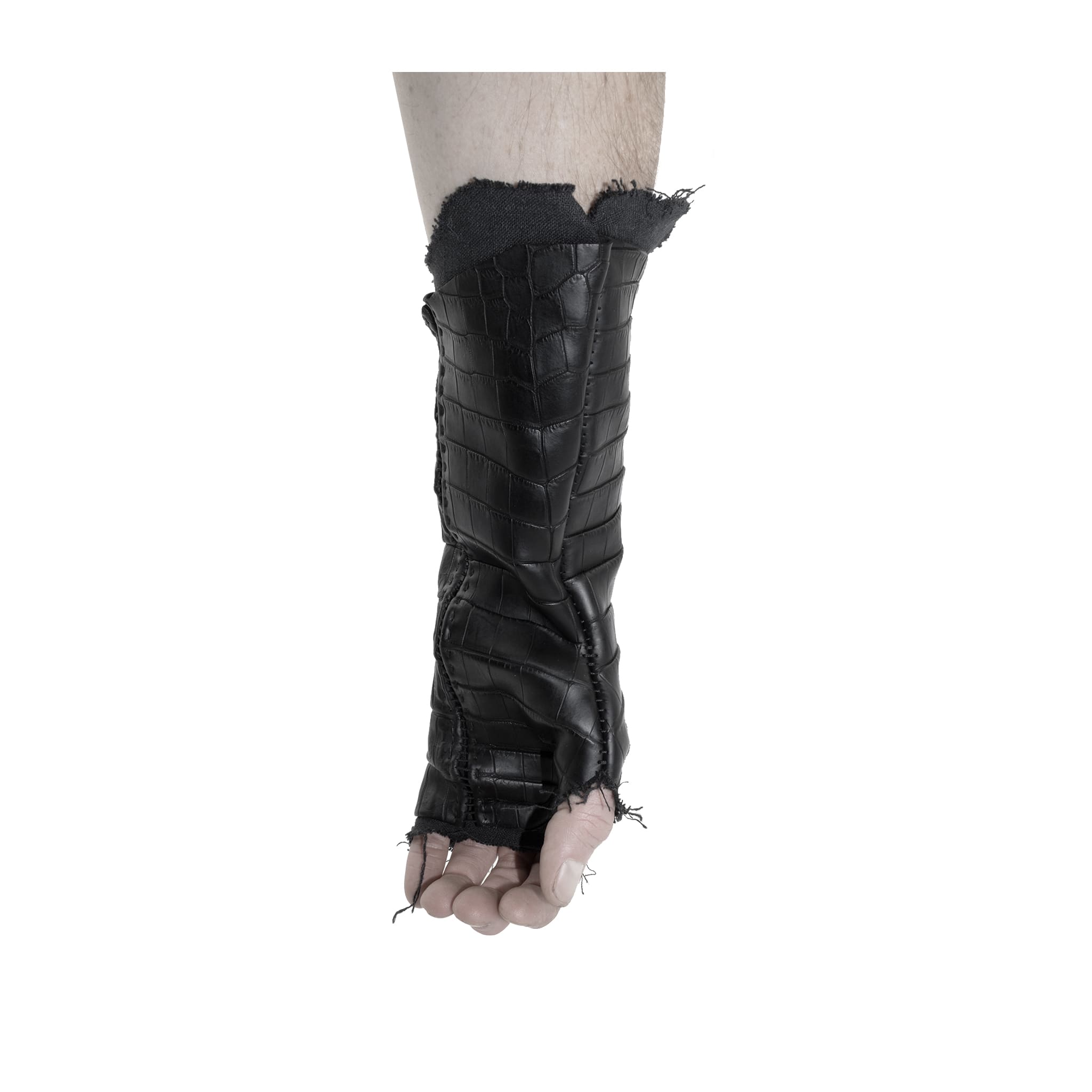 hand stitched over a 40hr period the genuine crocodile leather gloves feature deconstructed open seam panels, and a raw cut stone washed ramie lining. with an object dyed finish the gloves are then wet moulded on the body over an 8 hour period for a sculptured aesthetic. the gloves are available to buy online from avant garde leather studio atelierskn.com