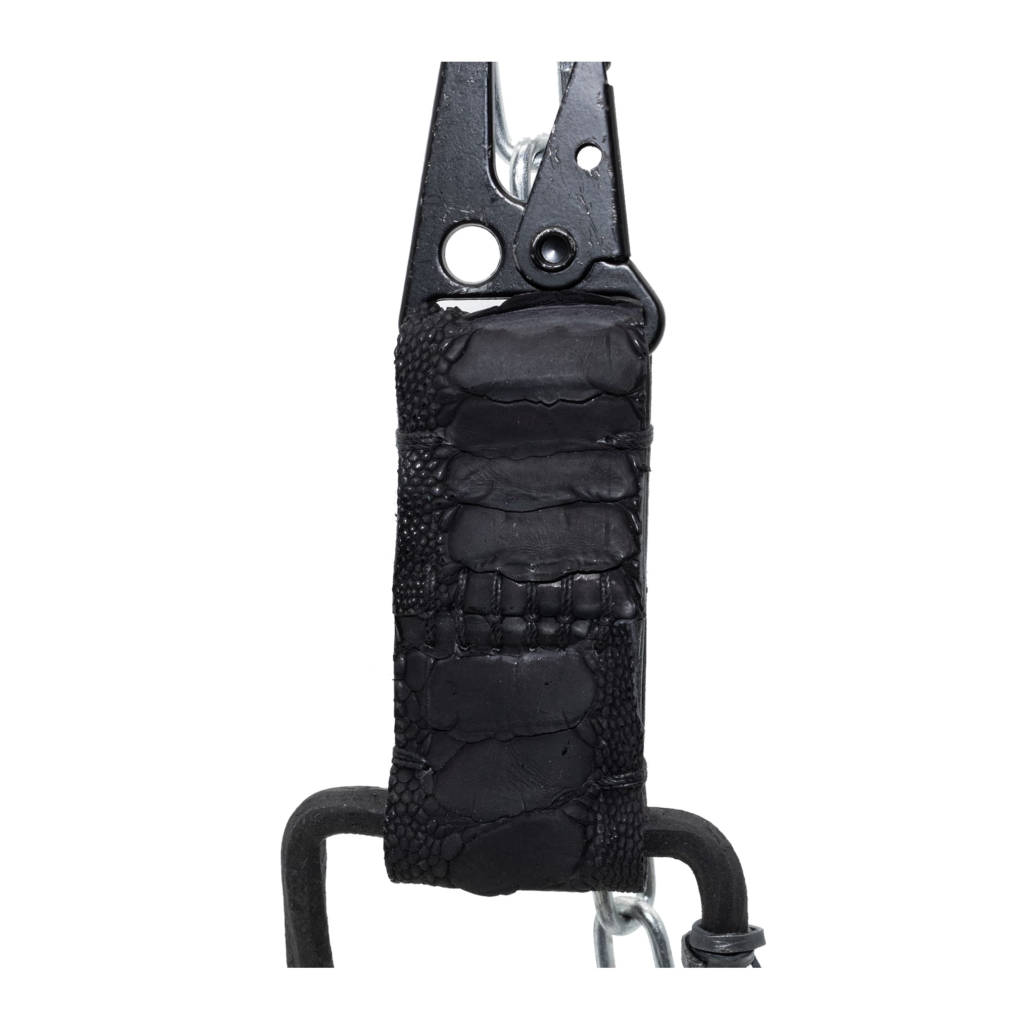 the hand sewn ostrich leather keychain features a flat matte black dye treatment and a distressed military sling clip. a hand forged black iron ring holds the oxidised .925 silver key ring. Buy online from avant garde leather studio atelier skn.