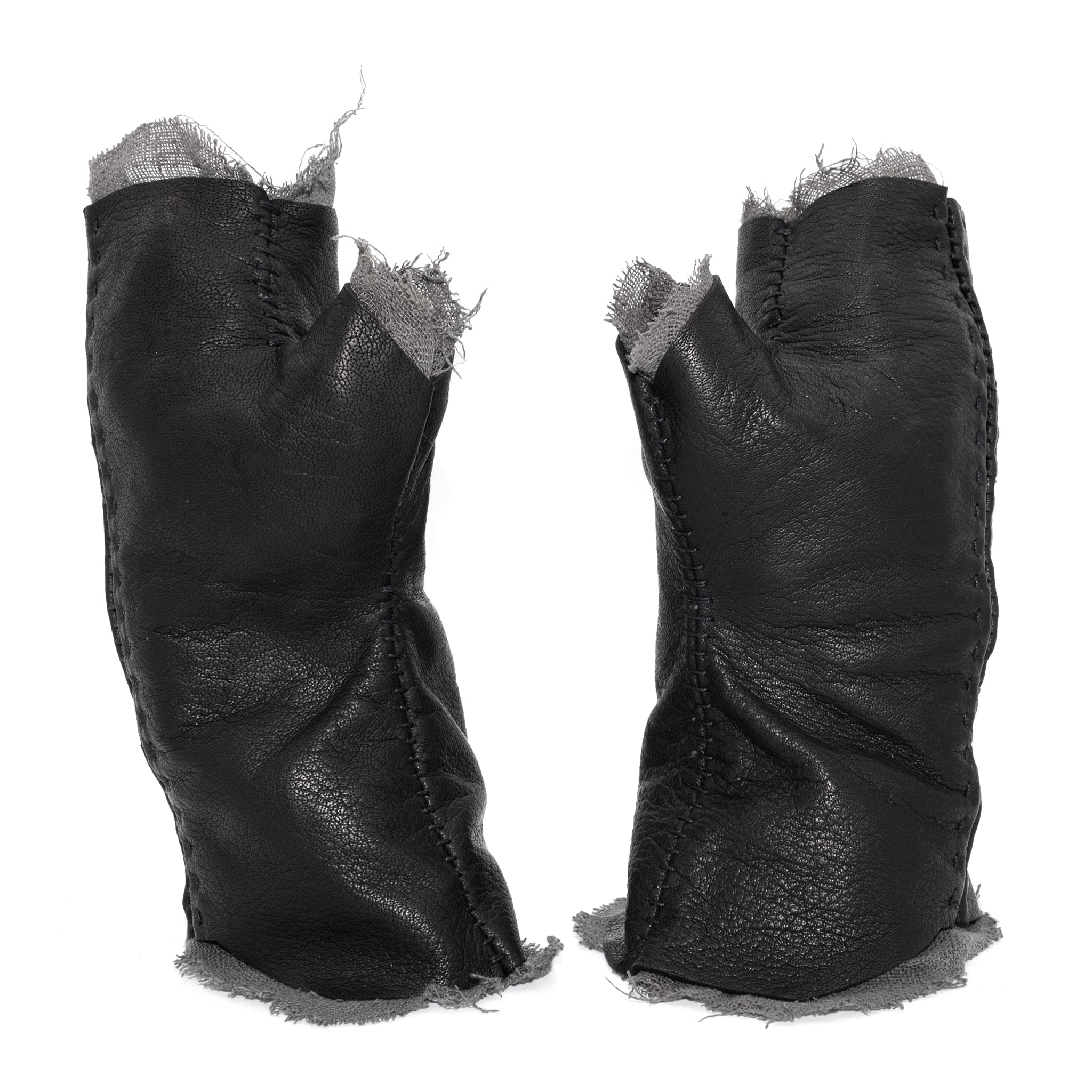 hand stitched over a 35hr period the washed kangaroo leather gloves feature deconstructed open seam panels, and an object dyed raw silk floating lining. the gloves are available to buy online from avant garde leather studio atelierskn.com
