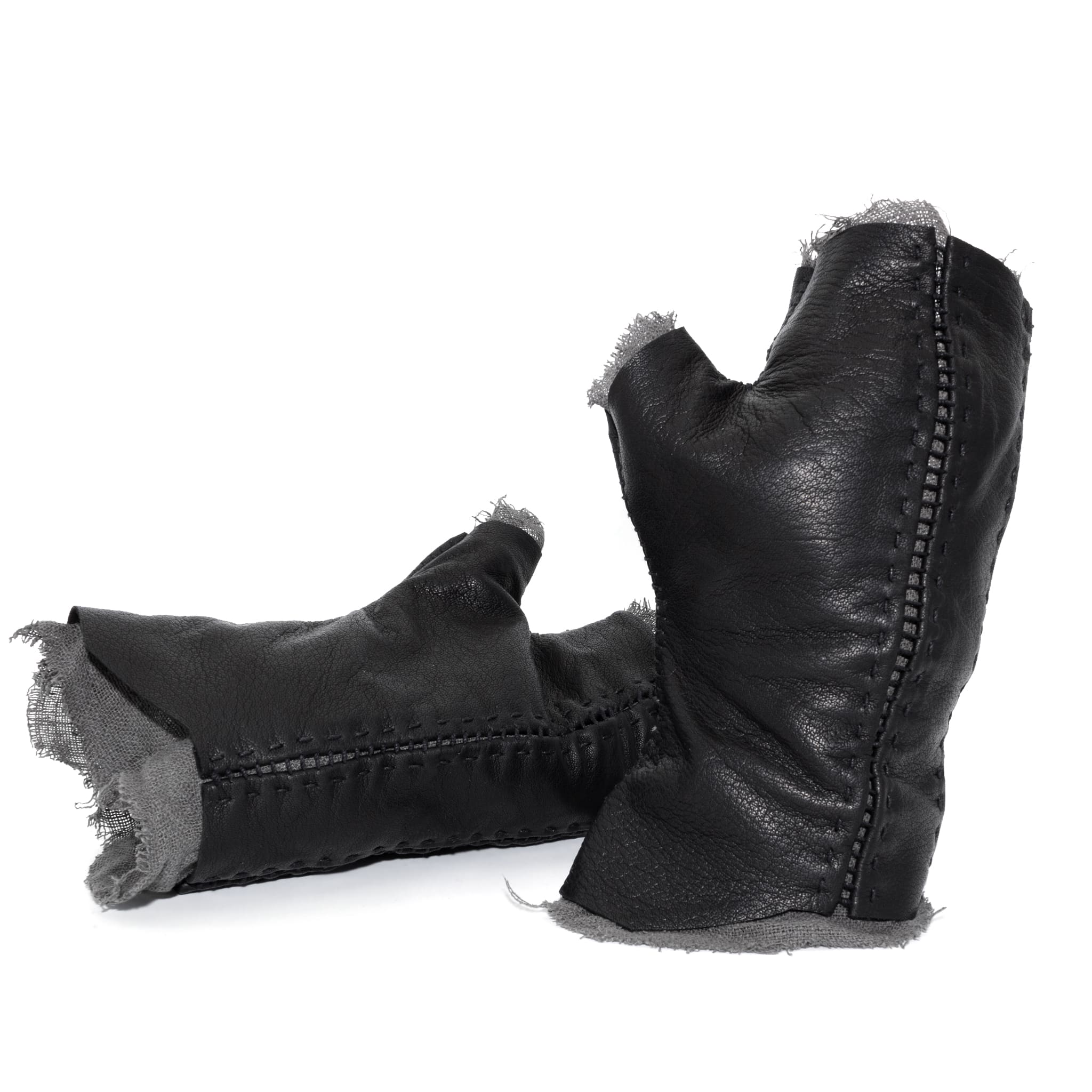 hand stitched over a 35hr period the washed kangaroo leather gloves feature deconstructed open seam panels, and an object dyed raw silk floating lining. the gloves are available to buy online from avant garde leather studio atelierskn.com