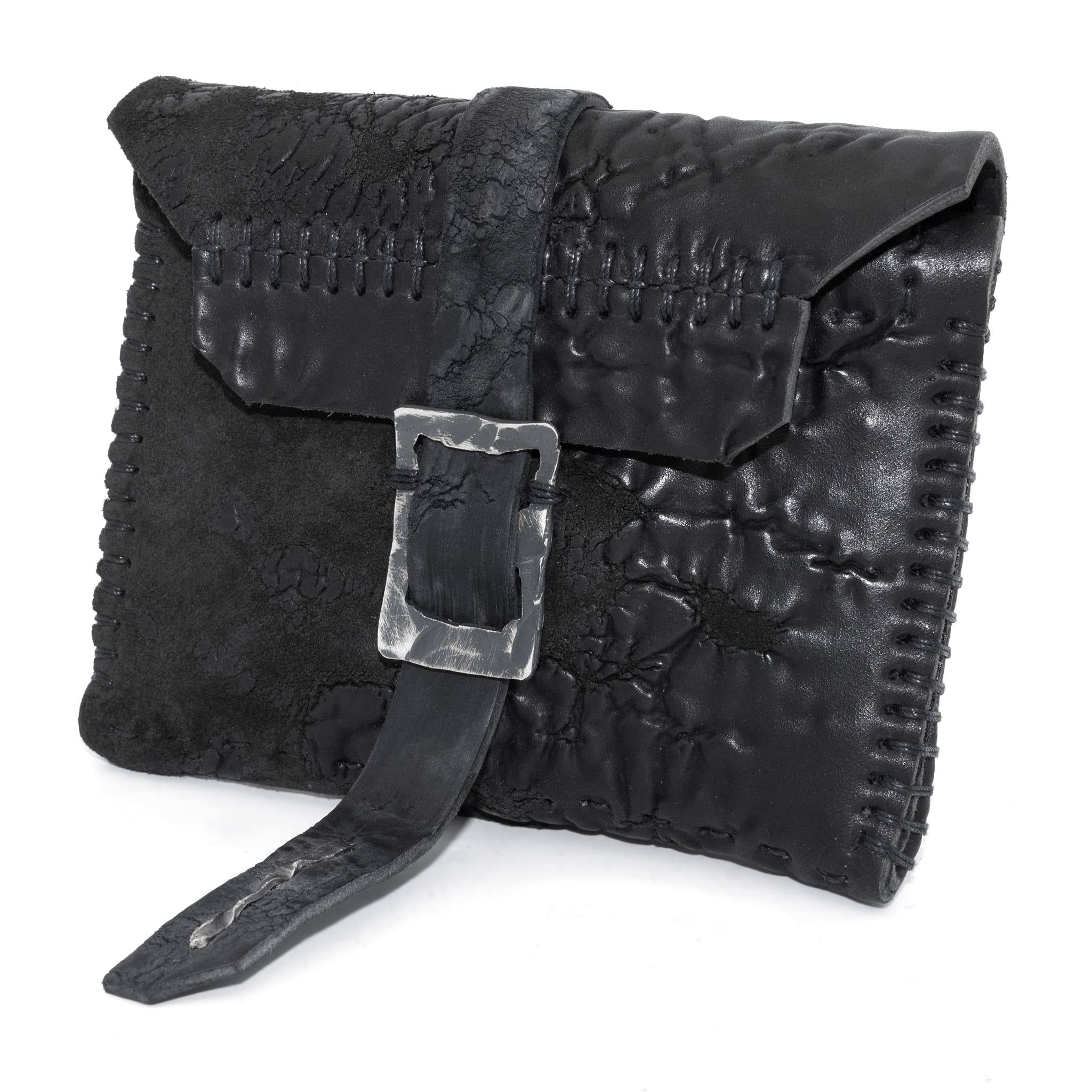 a zipper pocket cardholder crafted from a butter soft reverse culatta leather with a matte black object dyed finish in a single piece pattern construction. a riri zipper pocket is adorned with a hand forged solid .925sterling silver zipper pull, which compliments the hand forged solid silver buckle closure, available to buy online from artisanal leather studio atelierskn.com