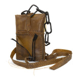 medium-sized transparent natural horse leather open seam cross body bag with a forged-iron chain link strap and zipper pocket on the back, completely handmade in the UK by atelier SKN