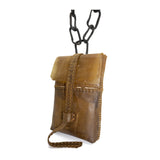 medium-sized transparent natural horse leather open seam cross body bag with a forged-iron chain link strap and zipper pocket on the back, completely handmade in the UK by atelier SKN