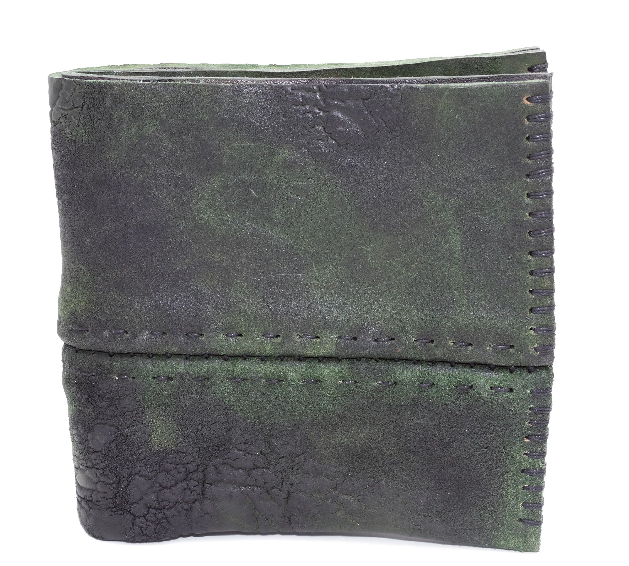 object dyed reverse horse culatta leather bifold wallet, meticulously hand stitched with a closed seam construction. multiple card pockets to the interior sit alongside a large note compartment. the wallet is available to buy online from atelierskn.com