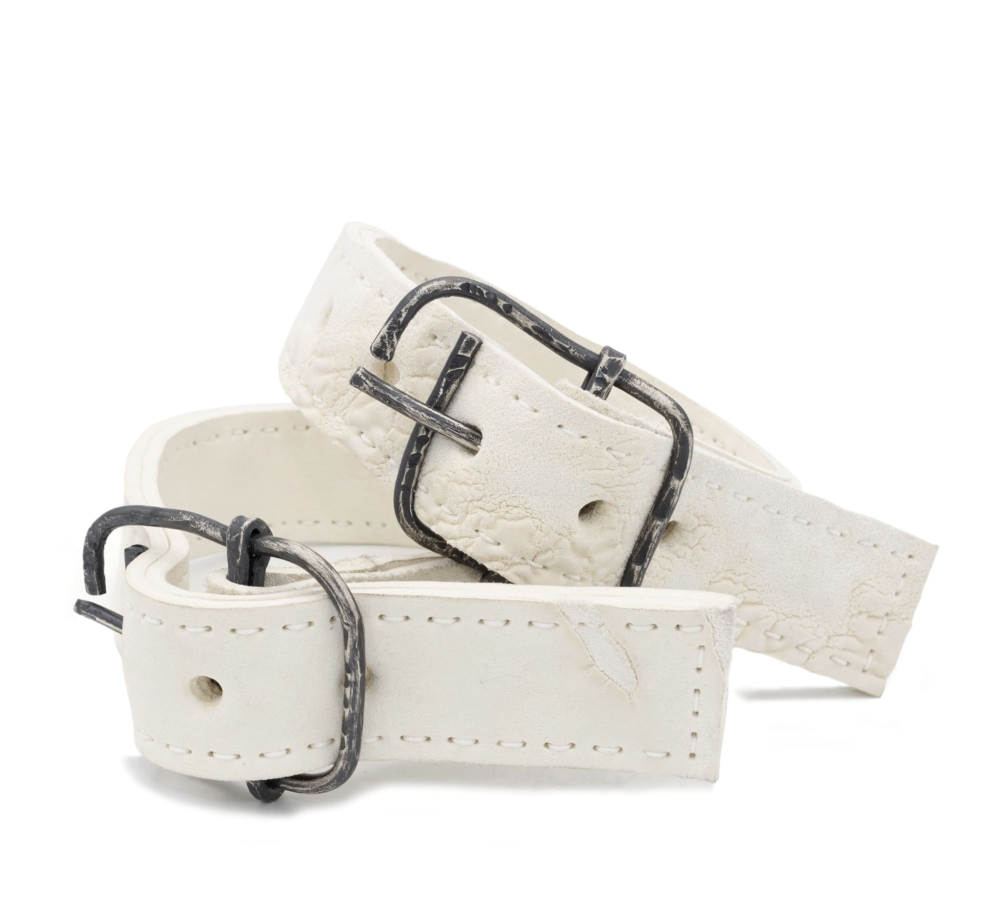avant garde hand stitched horse culatta leather bicep belts, in a crushed bone finish. the arm cuffs feature a minimal silhouette with tonal japanese linen stitching and a hand forged .925 sterling silver buckle hardware. the arm belts are available to buy online from artisanal designer atelierskn.com 
