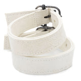 avant garde hand stitched horse culatta leather bicep belts, in a crushed bone finish. the arm cuffs feature a minimal silhouette with tonal japanese linen stitching and a hand forged .925 sterling silver buckle hardware. the arm belts are available to buy online from artisanal designer atelierskn.com 