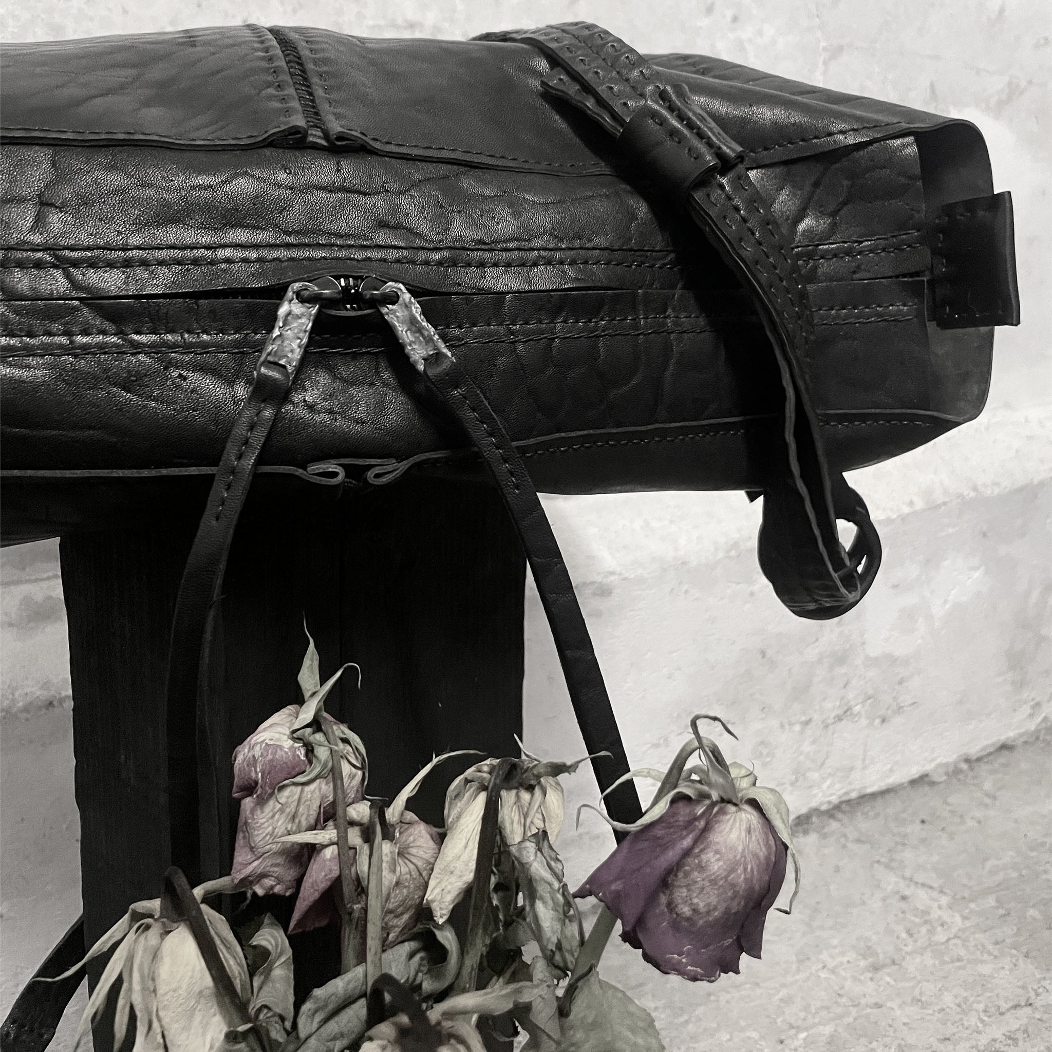 avant garde hand stitched horse leather bags, with hand forged .925 sterling silver and iron hardware, available to buy online from artisan leather studio atelierskn.com.