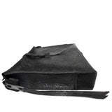 hand stitched over a 50hr period the washed cordovan clutch bag features deconstructed side panels, hand forged iron hardware and a riri zipper closure adorned with solid .925 sterling silver zipper pulls. the bag is available to buy online from avant garde leather studio atelierskn.com