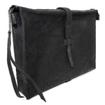 hand stitched over a 50hr period the washed cordovan clutch bag features deconstructed side panels, hand forged iron hardware and a riri zipper closure adorned with solid .925 sterling silver zipper pulls. the bag is available to buy online from avant garde leather studio atelierskn.com