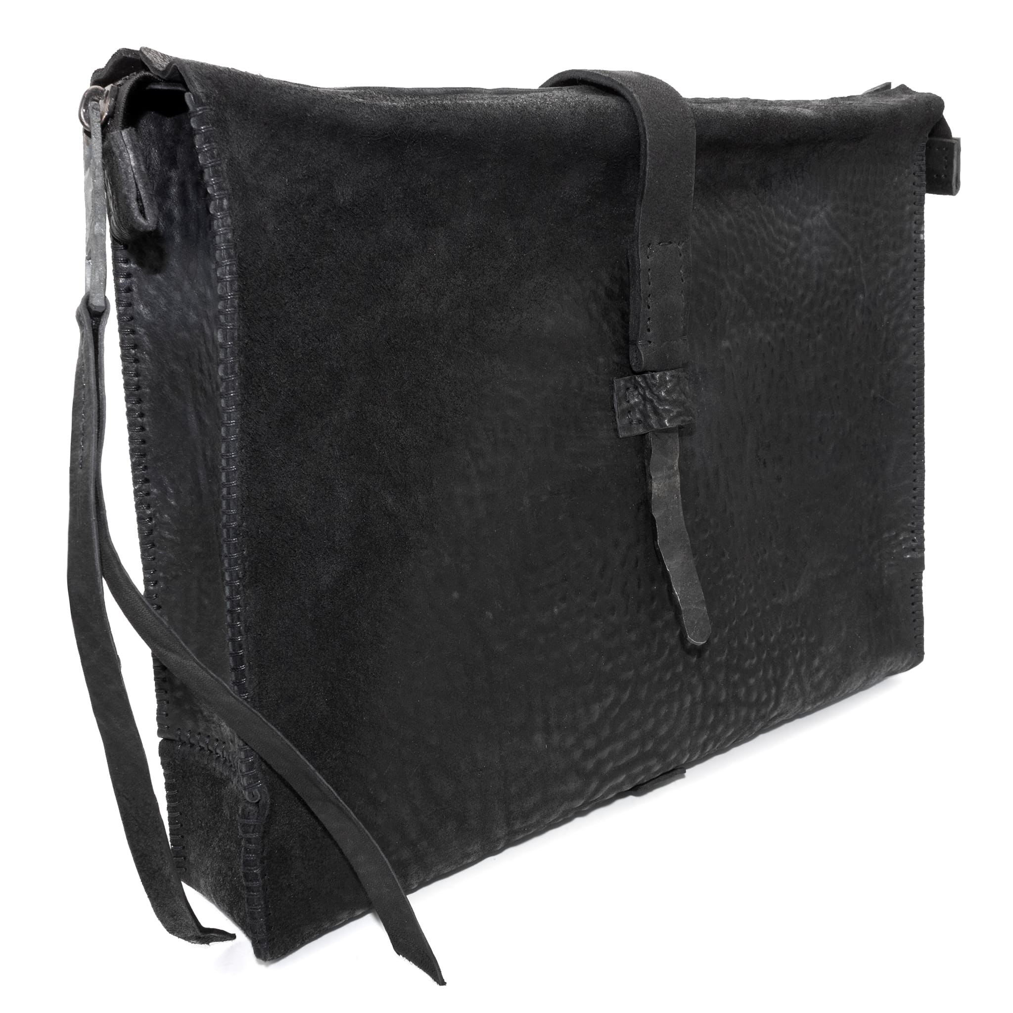 hand stitched over a 50hr period the washed cordovan clutch bag features deconstructed side panels, hand forged iron hardware and a riri zipper closure adorned with solid .925 sterling silver zipper pulls. the bag is available to buy online from avant garde leather studio atelierskn.com
