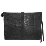 hand stitched over a 50hr period the washed cordovan clutch bag features deconstructed side panels, hand forged iron hardware and a riri zipper closure adorned with solid .925 sterling silver zipper pulls. the bag is available to buy online from avant garde leather studio atelierskn.com