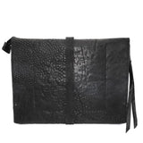 hand stitched over a 50hr period the washed cordovan clutch bag features deconstructed side panels, hand forged iron hardware and a riri zipper closure adorned with solid .925 sterling silver zipper pulls. the bag is available to buy online from avant garde leather studio atelierskn.com