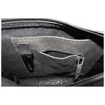 hand stitched over a 50hr period the washed cordovan clutch bag features deconstructed side panels, hand forged iron hardware and a riri zipper closure adorned with solid .925 sterling silver zipper pulls. the bag is available to buy online from avant garde leather studio atelierskn.com