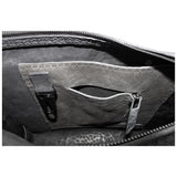 hand stitched over a 50hr period the washed cordovan clutch bag features deconstructed side panels, hand forged iron hardware and a riri zipper closure adorned with solid .925 sterling silver zipper pulls. the bag is available to buy online from avant garde leather studio atelierskn.com
