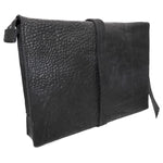 hand stitched over a 50hr period the washed cordovan clutch bag features deconstructed side panels, hand forged iron hardware and a riri zipper closure adorned with solid .925 sterling silver zipper pulls. the bag is available to buy online from avant garde leather studio atelierskn.com