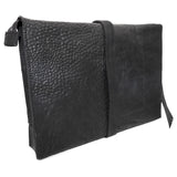 hand stitched over a 50hr period the washed cordovan clutch bag features deconstructed side panels, hand forged iron hardware and a riri zipper closure adorned with solid .925 sterling silver zipper pulls. the bag is available to buy online from avant garde leather studio atelierskn.com