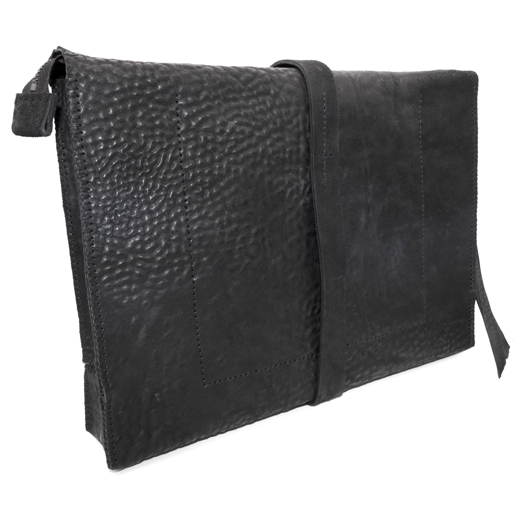 hand stitched over a 50hr period the washed cordovan clutch bag features deconstructed side panels, hand forged iron hardware and a riri zipper closure adorned with solid .925 sterling silver zipper pulls. the bag is available to buy online from avant garde leather studio atelierskn.com