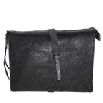 hand stitched over a 50hr period the washed cordovan clutch bag features deconstructed side panels, hand forged iron hardware and a riri zipper closure adorned with solid .925 sterling silver zipper pulls. the bag is available to buy online from avant garde leather studio atelierskn.com