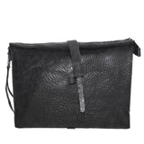 hand stitched over a 50hr period the washed cordovan clutch bag features deconstructed side panels, hand forged iron hardware and a riri zipper closure adorned with solid .925 sterling silver zipper pulls. the bag is available to buy online from avant garde leather studio atelierskn.com