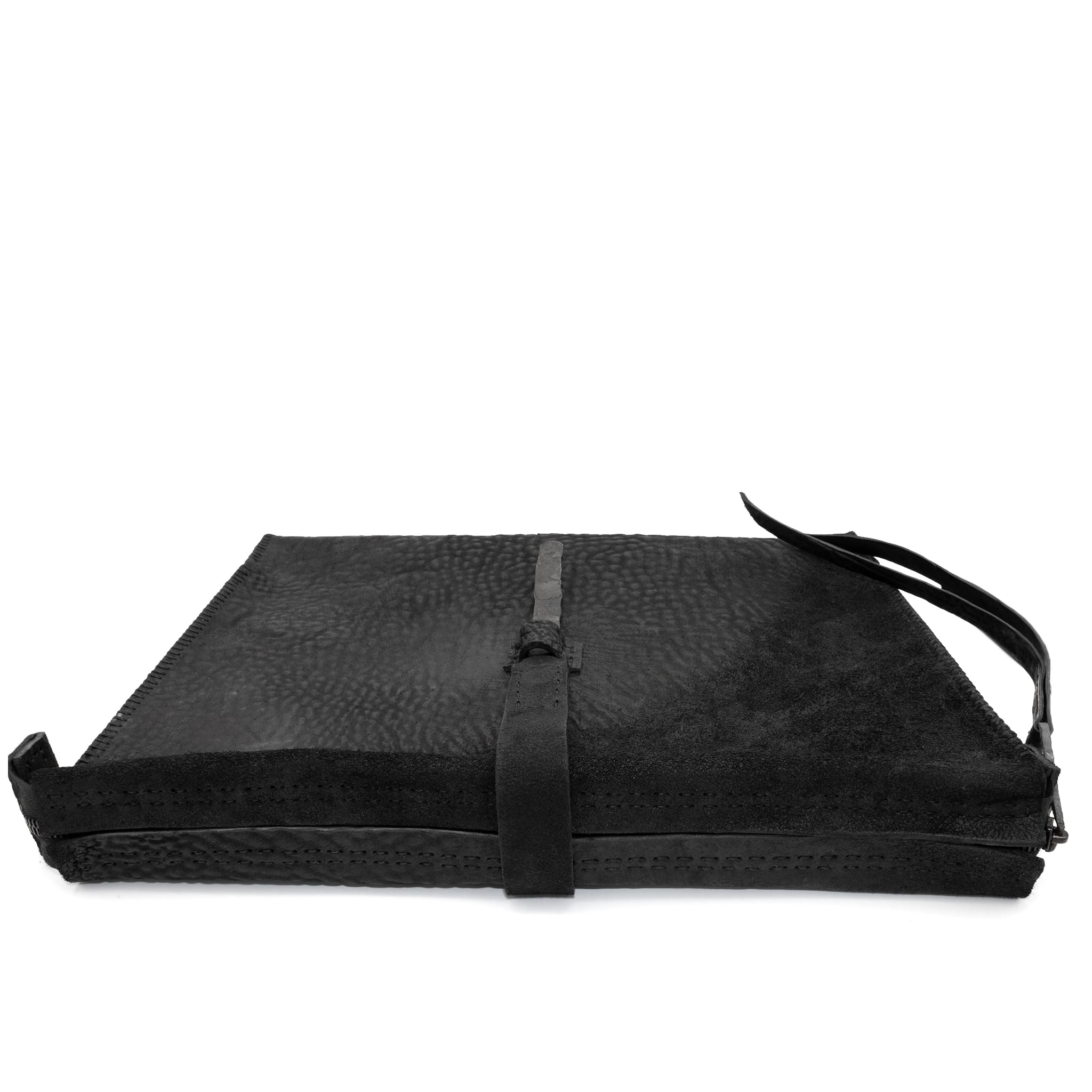 hand stitched over a 50hr period the washed cordovan clutch bag features deconstructed side panels, hand forged iron hardware and a riri zipper closure adorned with solid .925 sterling silver zipper pulls. the bag is available to buy online from avant garde leather studio atelierskn.com