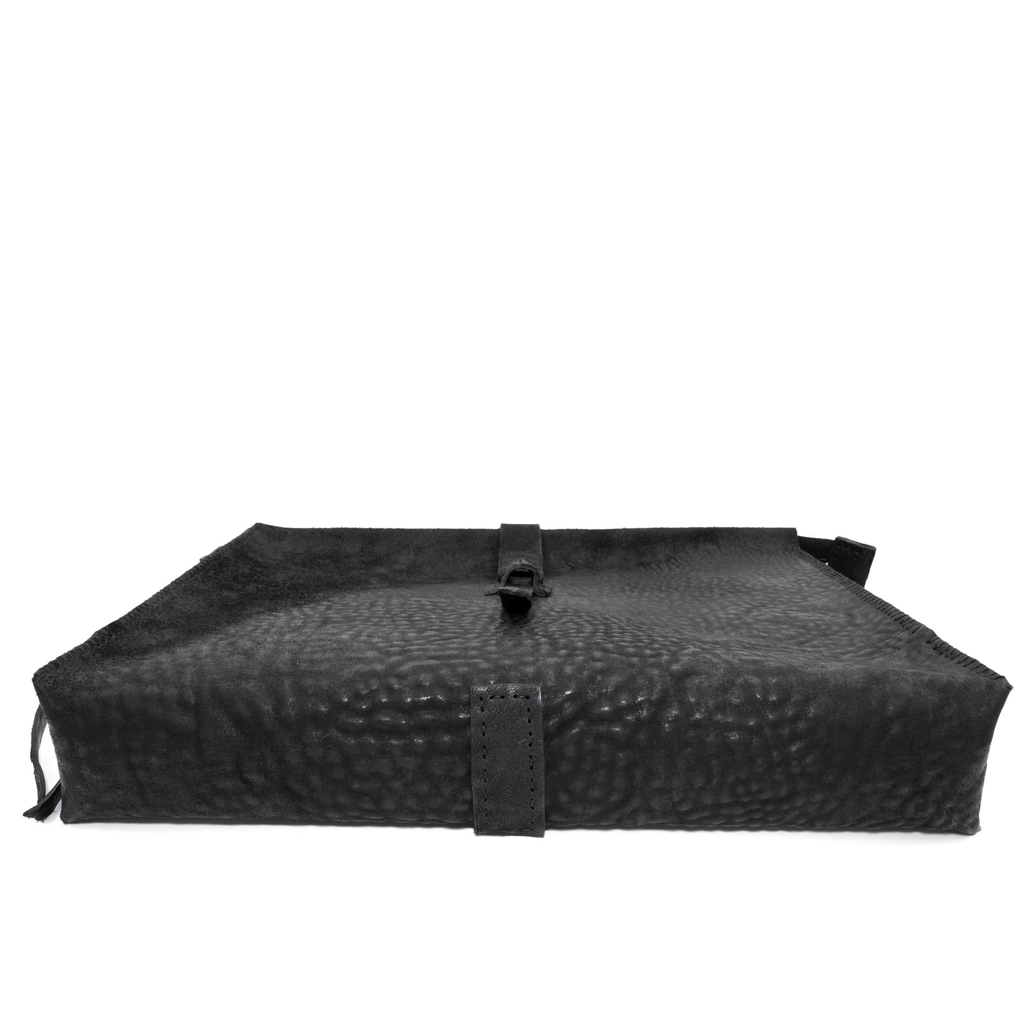 hand stitched over a 50hr period the washed cordovan clutch bag features deconstructed side panels, hand forged iron hardware and a riri zipper closure adorned with solid .925 sterling silver zipper pulls. the bag is available to buy online from avant garde leather studio atelierskn.com