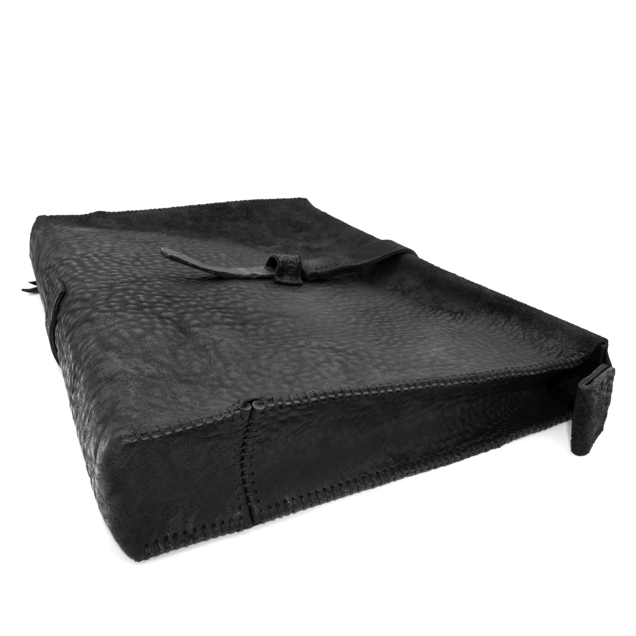 hand stitched over a 50hr period the washed cordovan clutch bag features deconstructed side panels, hand forged iron hardware and a riri zipper closure adorned with solid .925 sterling silver zipper pulls. the bag is available to buy online from avant garde leather studio atelierskn.com
