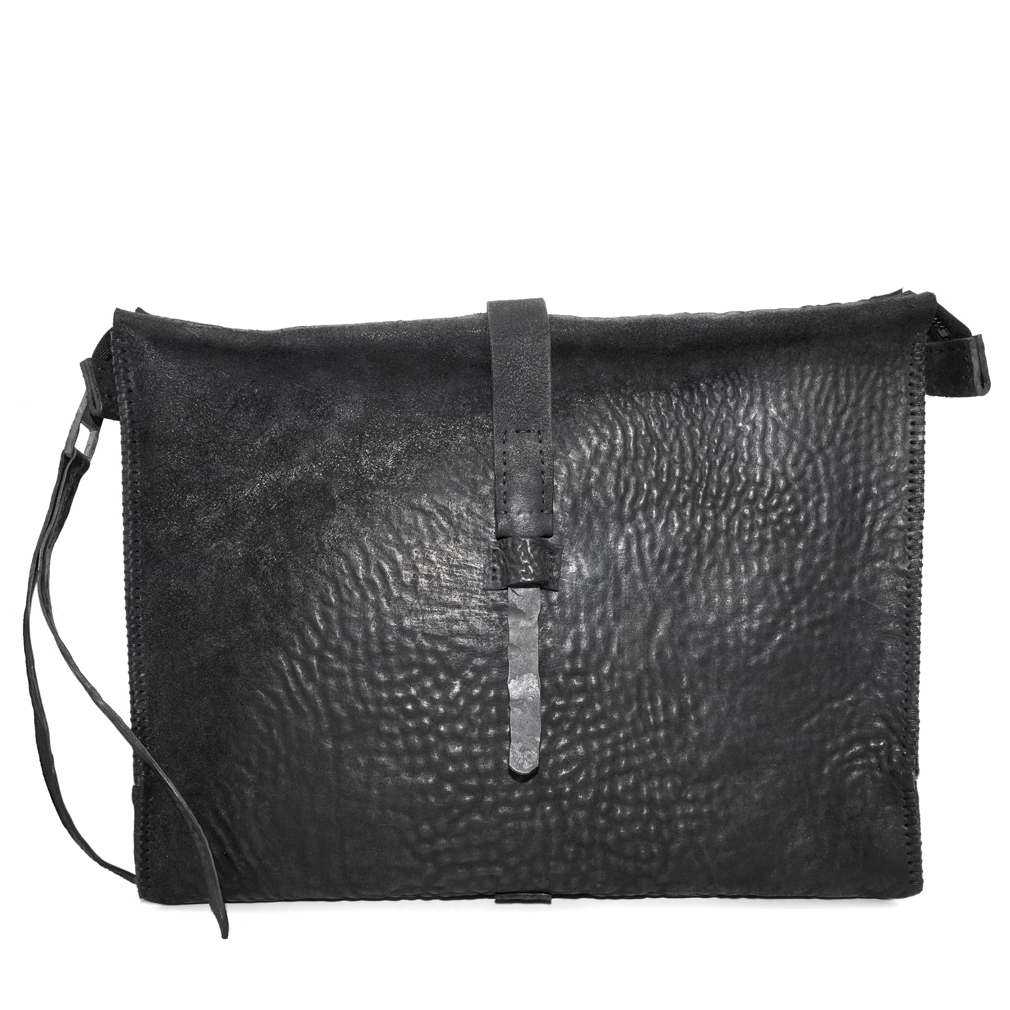 hand stitched over a 50hr period the washed cordovan clutch bag features deconstructed side panels, hand forged iron hardware and a riri zipper closure adorned with solid .925 sterling silver zipper pulls. the bag is available to buy online from avant garde leather studio atelierskn.com